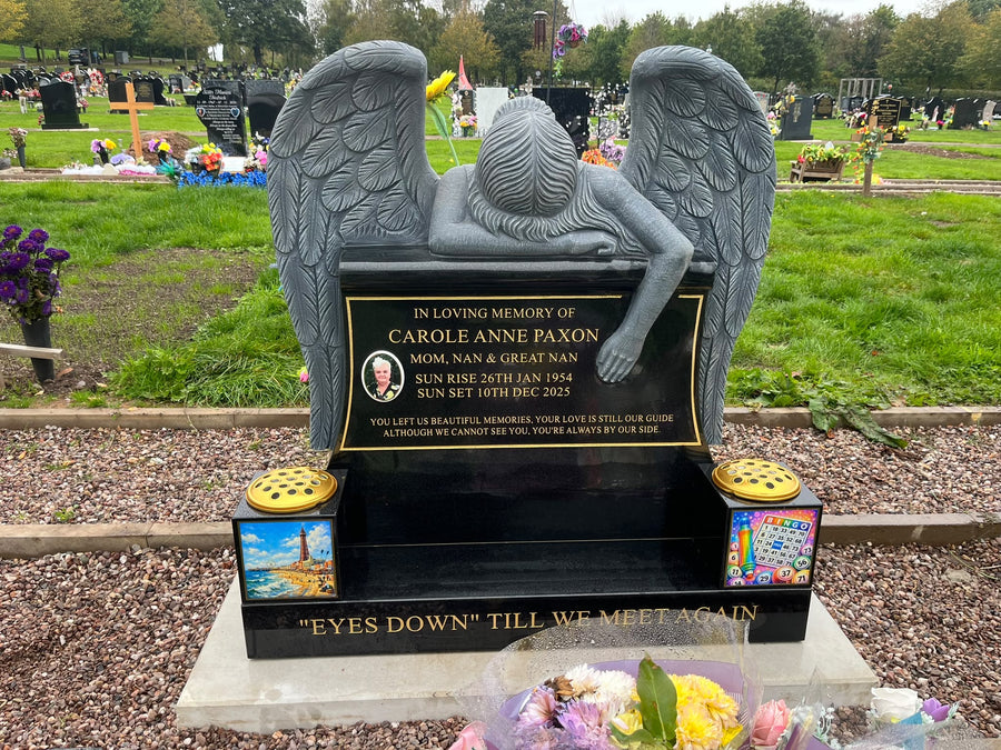 Installed carved angel wing memorial with personalised granite lettering