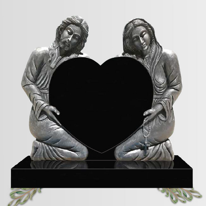 Heart shaped granite headstone featuring a hand-carved image of Mary and Jesus, fully customisable with high-resolution images and personalised inscriptions.